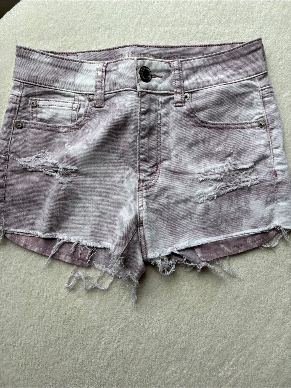 American Eagle cutoff distressed hi-rise jean shorts sz 0 lavender tie-dye 2”